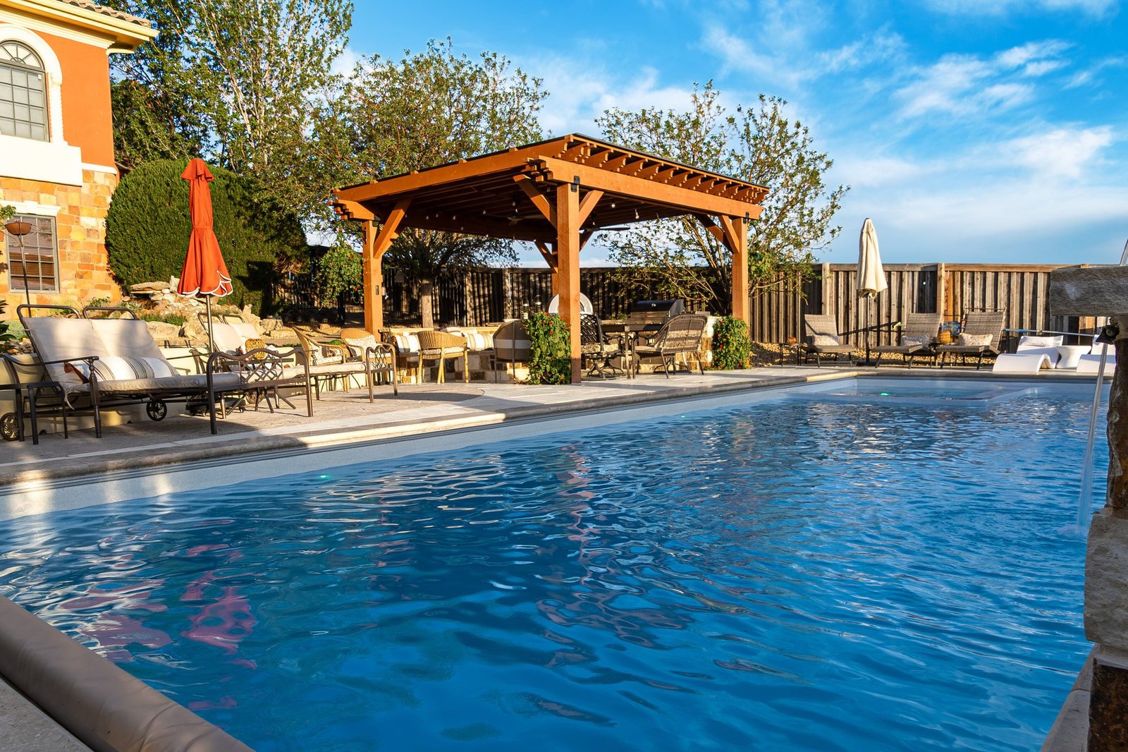 Poolside hardscape and outdoor living space, Colorado landscape design